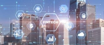 A conceptual image shows the words "Fintech" and "Financial Technology" against a blurry cityscape.