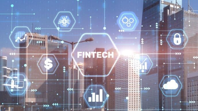 A conceptual image shows the words "Fintech" and "Financial Technology" against a blurry cityscape.
