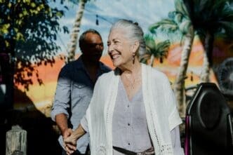 Happy elderly couple smiling while on vacation.