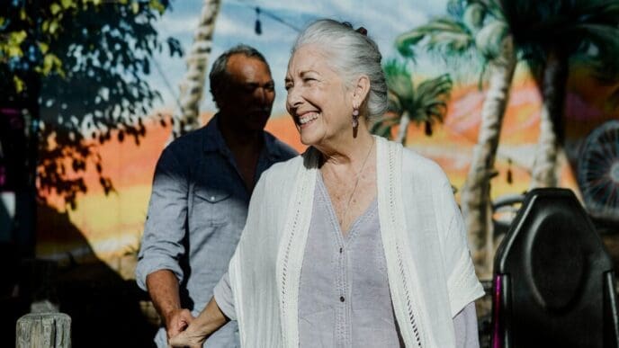 Happy elderly couple smiling while on vacation.