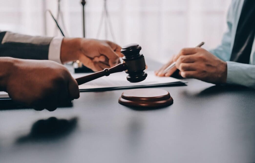 A lawyer explains legal documents to a client.