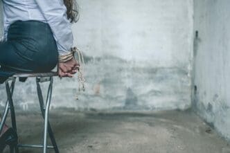 Low-angle view of a woman standing outside.