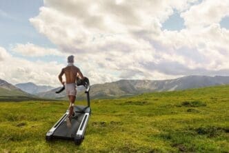A man runs on a treadmill, representing exercise, fitness, and a healthy lifestyle.