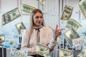 A smiling Caucasian woman celebrates with dollar bills floating around her.