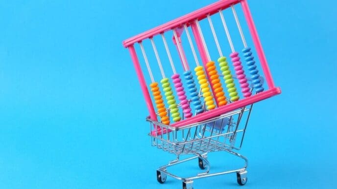 A shopping cart icon with an abacus inside sits on a light blue background.