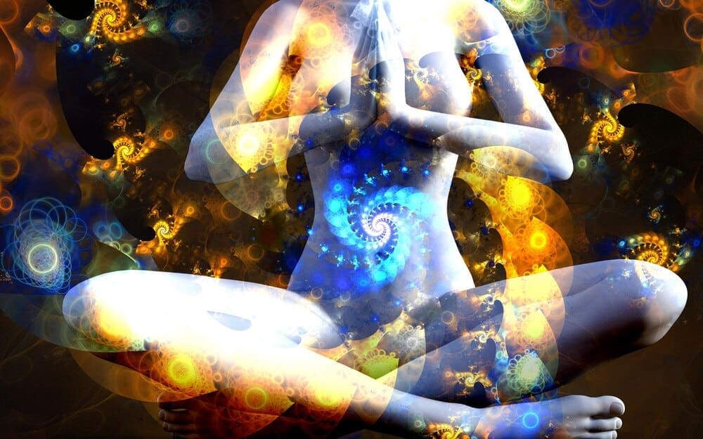 Silhouette of a girl in the lotus position is set against a vibrant, swirling fractal universe illustration.