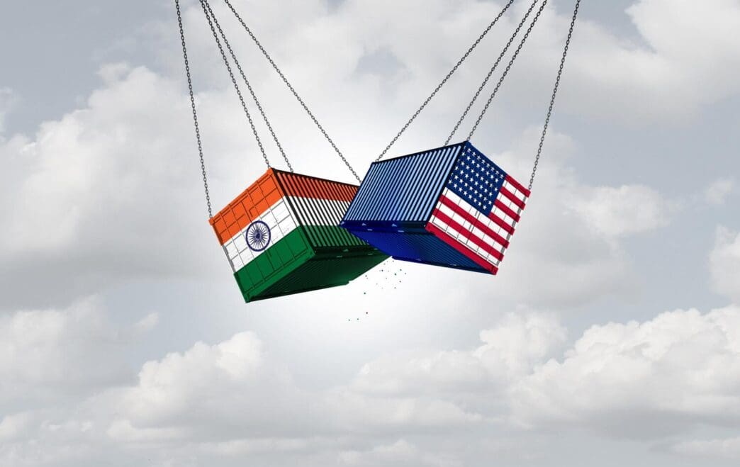 A graphic depicts the USA and India engaged in a trade war, illustrating an economic conflict over tariffs and trade relationships.