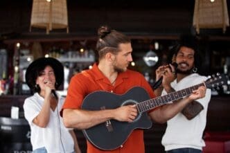 Young adults laugh and smile while enjoying an open mic night.