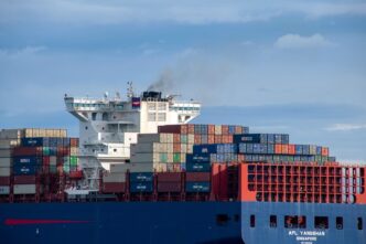 The APL Yangshan cargo ship sails on the Strait of Juan de Fuca with a full load of shipping containers
