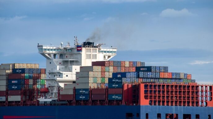 The APL Yangshan cargo ship sails on the Strait of Juan de Fuca with a full load of shipping containers