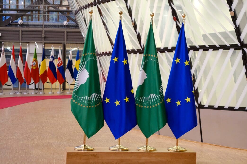 Flags of the African Union and European Union displayed together at an event