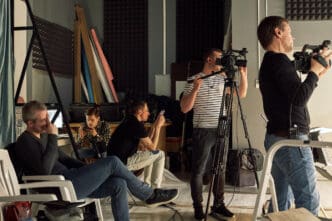 Filmmakers are busy with their equipment on the set