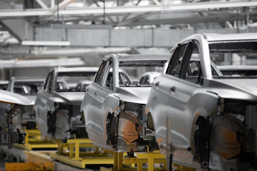 Unfinished car bodies on an assembly line in a manufacturing plant
