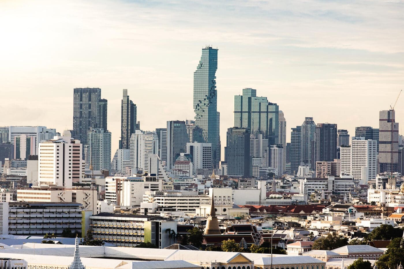 Bangkok, Thailand financial district skyline with skyscrapers and a stupa