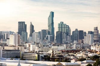 Bangkok, Thailand financial district skyline with skyscrapers and a stupa