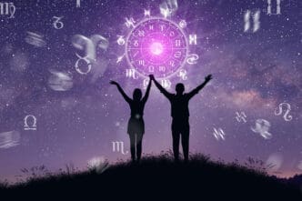 Silhouettes of a couple holding hands against a starry sky with zodiac symbols