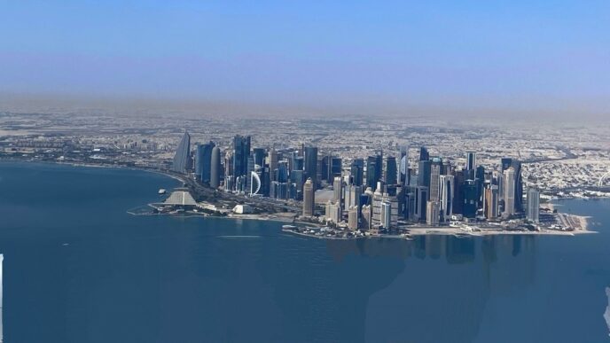 The modern and impressive skyline of Doha, Qatar, next to the calm waters of the Persian Gulf