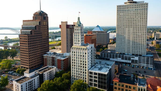 An aerial view of the Downtown Memphis, Tennessee skyline at sunset with the Mississippi River in the background