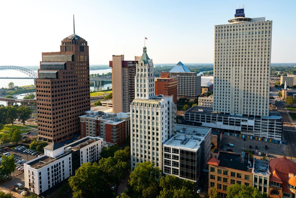 An aerial view of the Downtown Memphis, Tennessee skyline at sunset with the Mississippi River in the background