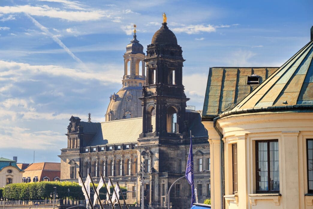 The Dresden Frauenkirche and Higher Regional Court under a partly cloudy sky