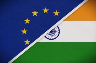 A composite image showing the flags of the European Union and India joined together by a diagonal line.