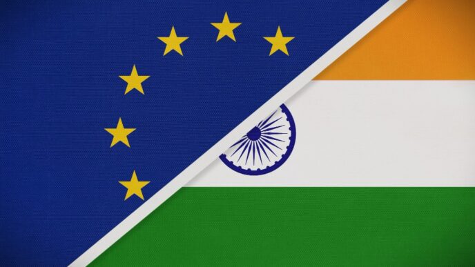 A composite image showing the flags of the European Union and India joined together by a diagonal line.
