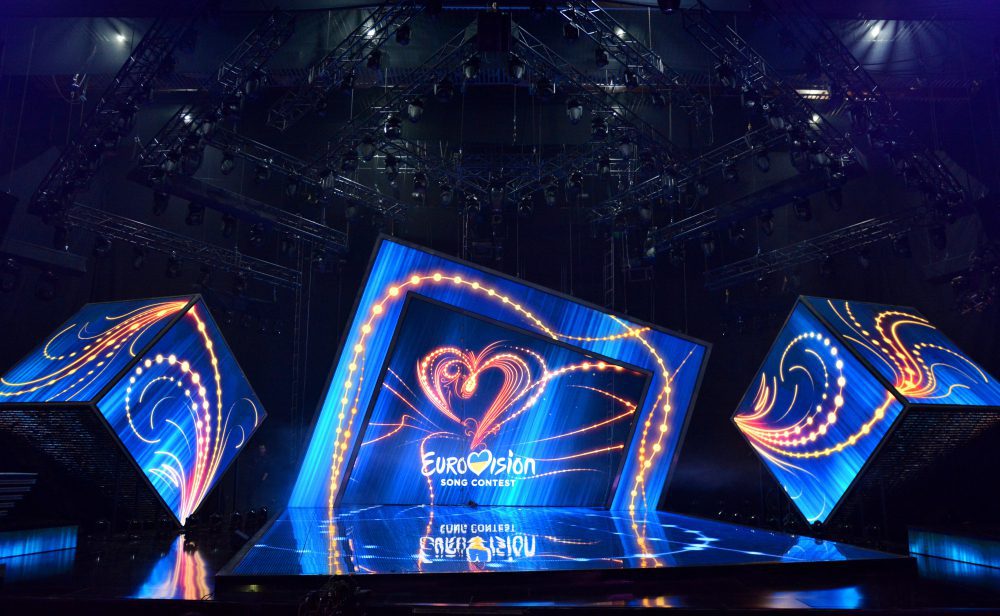 The stage of the Eurovision Song Contest with a large screen displaying the contest's logo