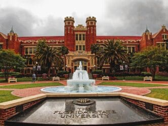 The fountain and courtyard in front of the historic red brick building of Florida State University's Ruby Diamond Auditorium