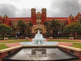 The fountain and courtyard in front of the historic red brick building of Florida State University's Ruby Diamond Auditorium
