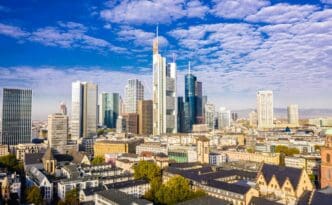 Panoramic view of Frankfurt's skyline with modern skyscrapers and historic buildings