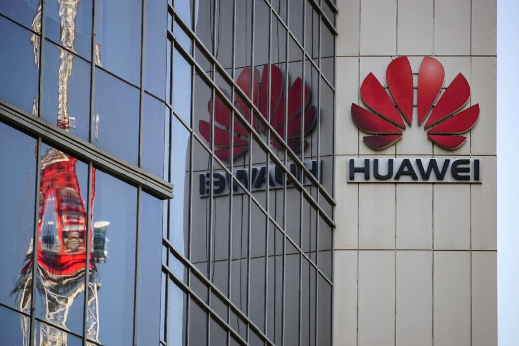 The red Huawei logo is displayed on the facade of a large building