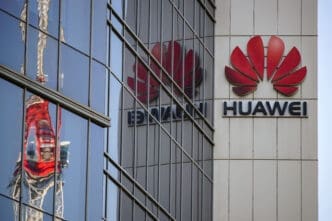 The red Huawei logo is displayed on the facade of a large building