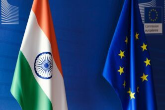The flags of India and the European Union are displayed side-by-side