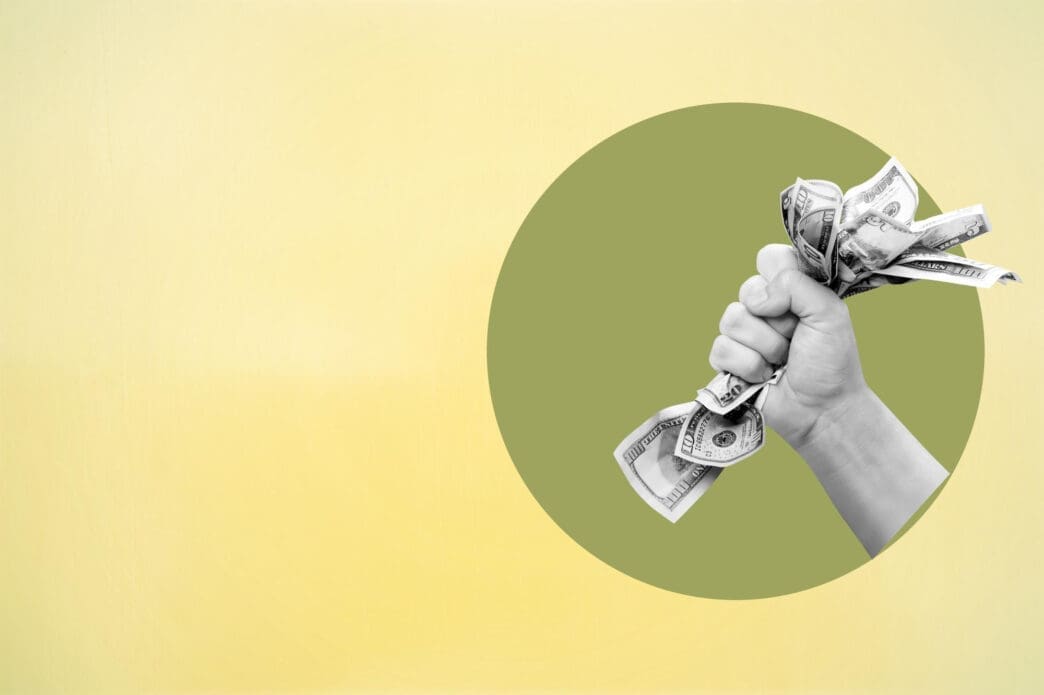 A digital collage of a hand grabbing crumpled dollar bills inside a green circle