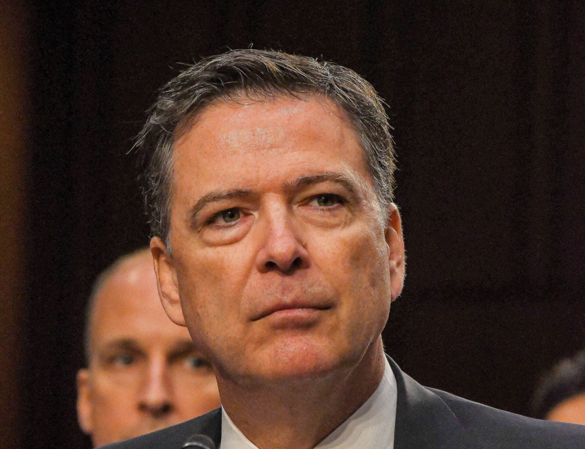 Former FBI Director James Comey testifies before the Senate Intelligence Committee