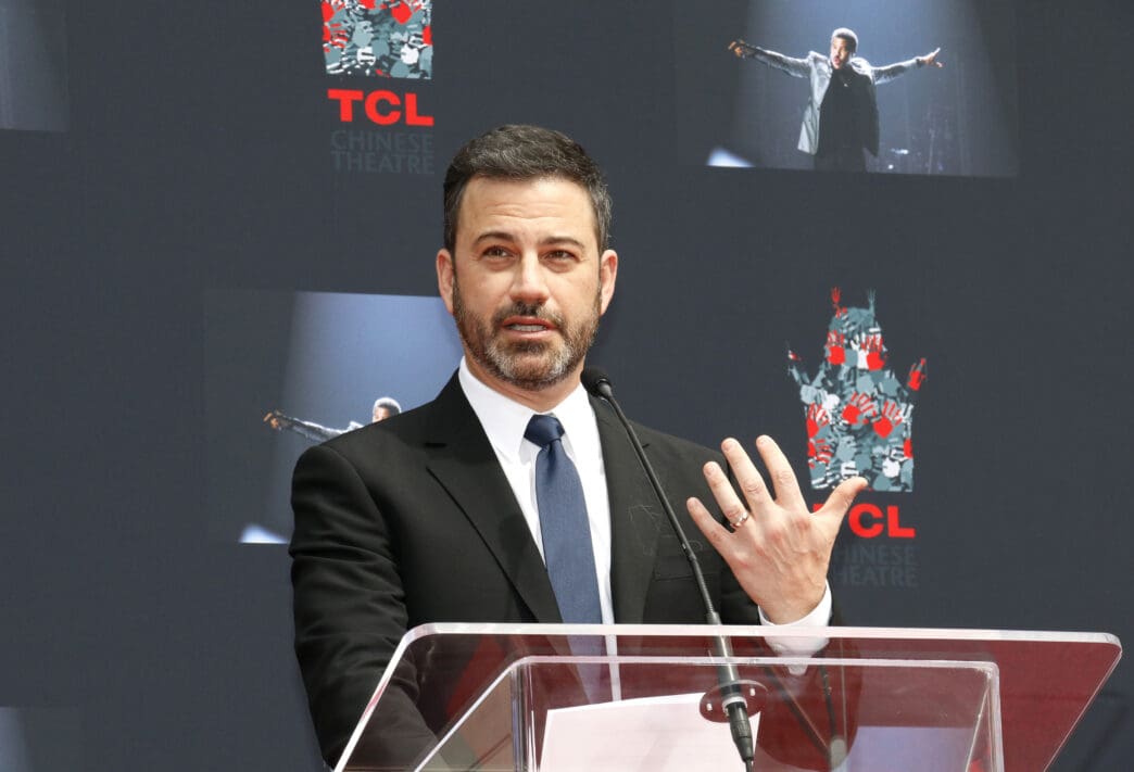 Jimmy Kimmel speaks at a podium at the TCL Chinese Theatre event