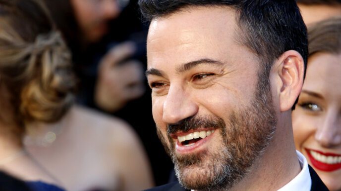 Jimmy Kimmel smiling and laughing while on the red carpet at the Academy Awards