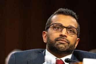 Kashyap Patel looks on with a serious expression during his nomination hearing for FBI Director