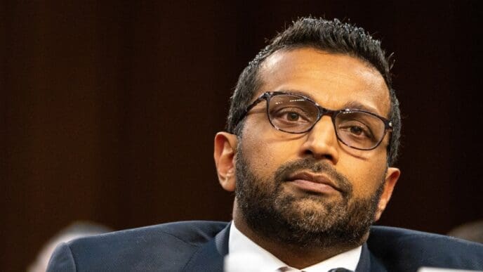 Kashyap Patel looks on with a serious expression during his nomination hearing for FBI Director