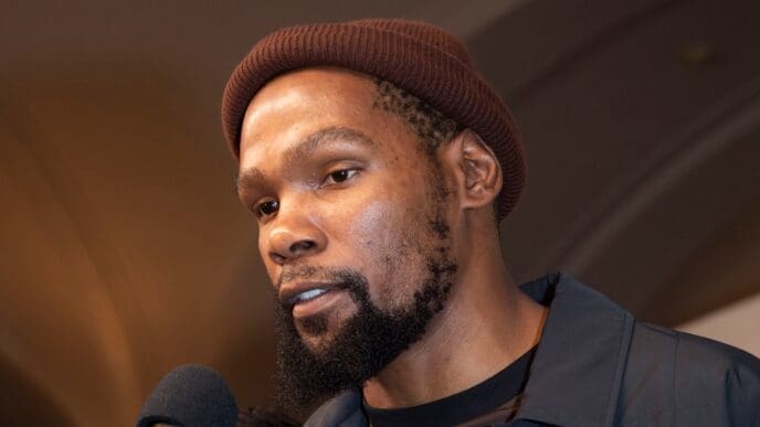 Kevin Durant, a professional basketball player, speaking into a microphone at a premiere event