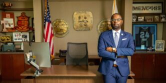 Memphis Mayor Paul Young stands with his arms crossed in his office in front of a desk