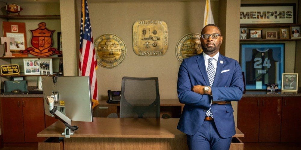 Memphis Mayor Paul Young stands with his arms crossed in his office in front of a desk