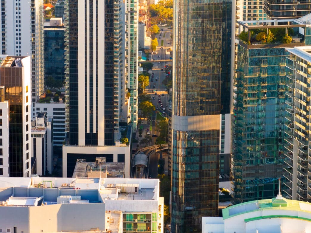 Aerial view of Miami's Brickell office district at sunset, showing modern skyscrapers.