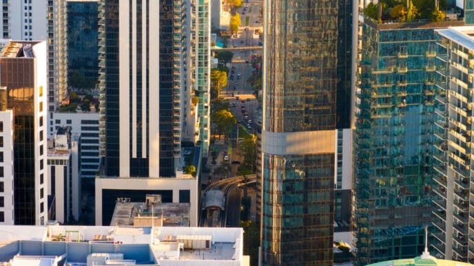 Aerial view of Miami's Brickell office district at sunset, showing modern skyscrapers.
