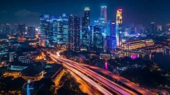 A sprawling cityscape at night with illuminated skyscrapers and light trails from traffic