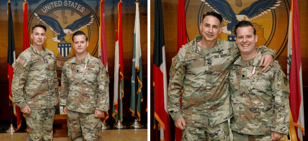 Two US Army officers pose for a photo with medals displayed