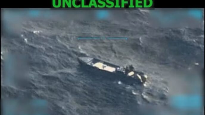 A screengrab from a military surveillance video of a small boat on the open ocean