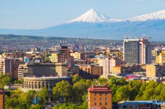 The snow-capped peak of Mount Ararat rises over the city of Yerevan, Armenia