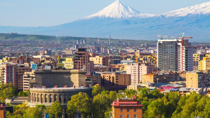 The snow-capped peak of Mount Ararat rises over the city of Yerevan, Armenia
