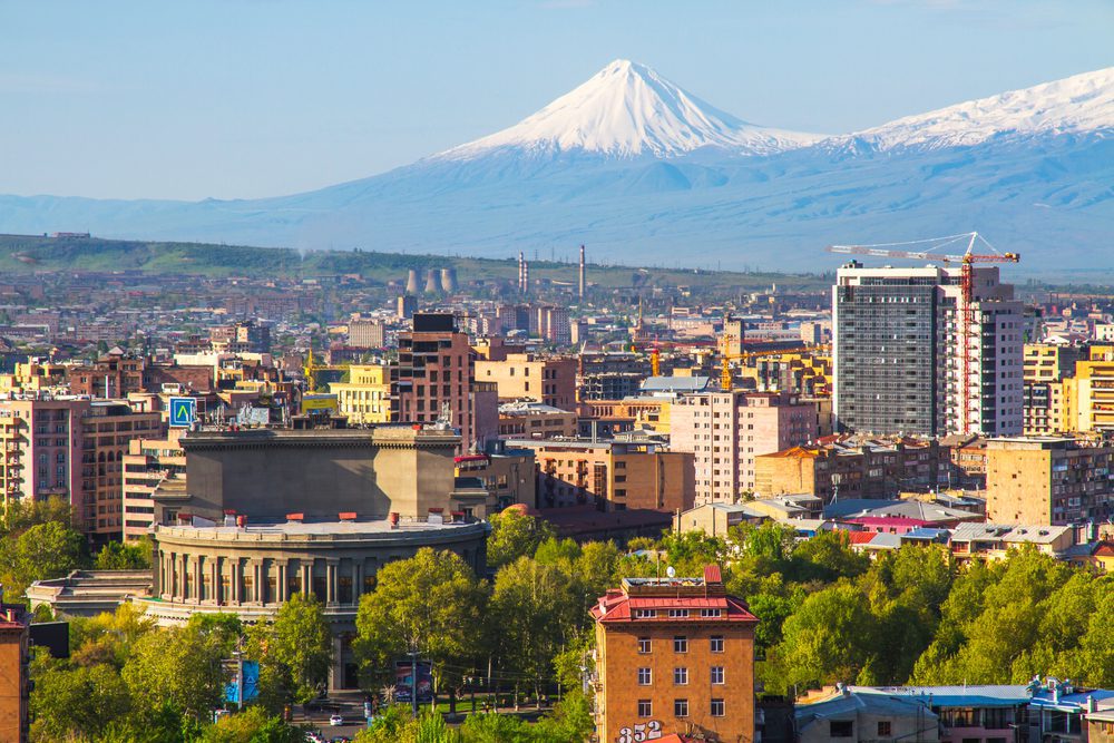 The snow-capped peak of Mount Ararat rises over the city of Yerevan, Armenia
